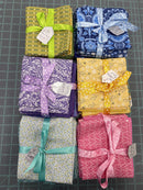 Stash Building Fat Quarter Bundles! Assorted bundles in green/yellow, blue, purple, yellow, teal, and pink! - Sewjersey.com 