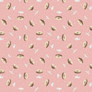 Fabric swatch featuring tossed martini glasses on a pink background. 