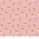 Fabric swatch featuring tossed martini glasses on a pink background.  There is a ruler at the bottom to show the scale of the pattern