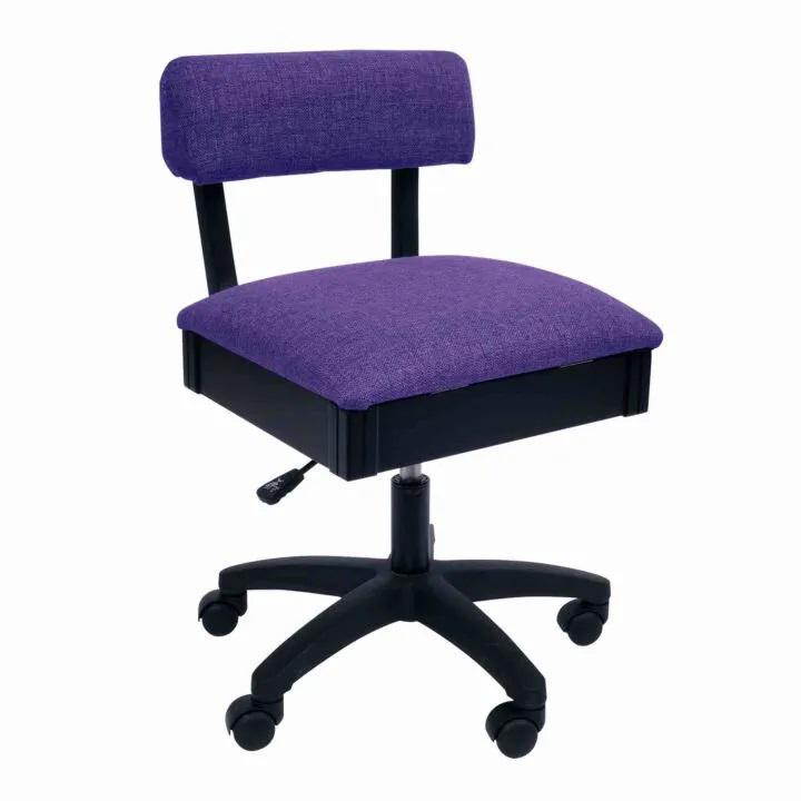 A front view of the arrow hydraulic sewing chair in the color royal purple