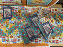 A collection of beach comber kits laid atop a sample of the completed table runner. 