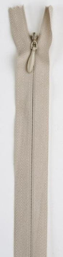 Beige invisible zipper on a white background