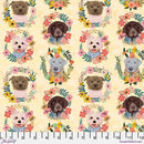 A fabric swatch featuring various dogs surrounded by flower wreaths on a light yellow background. There is a ruler at the bottom of the swatch for scale