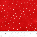 Swatch of red fabric with light pink polka dots with a ruler at the bottom for scale