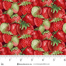 Fabric featuring packed red and green strawberries with a ruler for scale