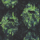 Batik fabric swatch patterned with bears in a green forest scene. The background gives the illusion of them peaking out through the trees. 