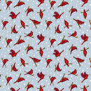 Pattern of red cardinals on a blue background with white dots