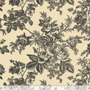 A repeating black floral toile pattern on a warm cream background, shown as a fabric or wallpaper swatch with a ruler along the bottom edge.