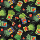Fabric patterned with tossed tomato cans with herbs and tomatoes on a black background. 