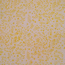 Patterned fabric with yellow geometric shapes on a light background