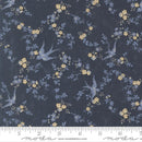 Floral and bird patterned fabric with a ruler at the bottom