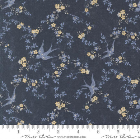 Floral and bird patterned fabric with a ruler at the bottom