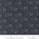 Patterned fabric with paisley design on a dark blue background, featuring a ruler at the bottom for scale.