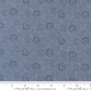 Blue fabric pattern with black swirls and floral designs, featuring a ruler for scale.