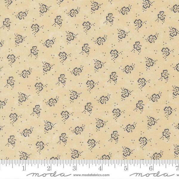 Floral patterned fabric with a ruler for scale on a beige background