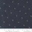 Navy fabric with small white floral pattern and Moda label at the bottom.