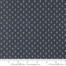 Navy fabric with small white floral pattern and Moda label at the bottom.