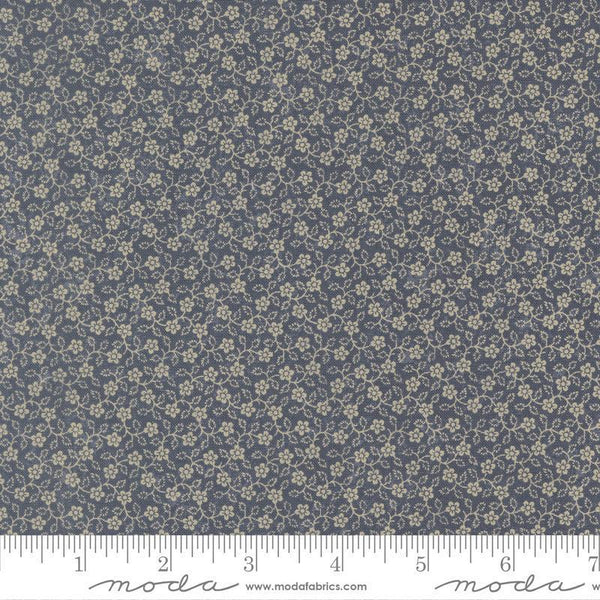 Floral patterned fabric with a ruler at the bottom for scale
