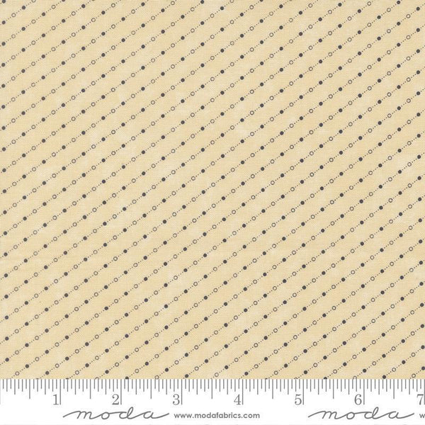 Fabric with a small dot pattern on a beige background
