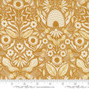 Fabric patterned with white bees, beehives, flowers, and leaves on a gold background. There is a ruler at the bottom for scale. 