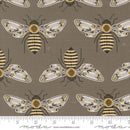 Pattern of honeybees on a slate gray background. The gold in the image is metallic. There is a ruler at the bottom for scale.