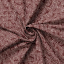 Close-up of patterned fabric with a focus on texture and color.