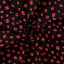 Black fabric with red maple leaf pattern