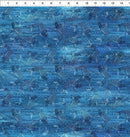 A fabric swatch patterned with blue koi fish on a blue background. The background features intricate, Asian inspired tone on tone patterns. There is a ruler along the top edge for scale. 