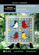 Quilt pattern featuring four adorable birds on a light blue background. 