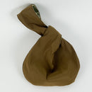 An example of the reverse side of the Japanese knot bag, the kit for which is available in this class. The fabric featured is a rich brown color. 