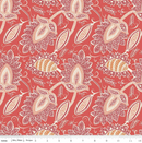 Intricate damask floral patterned fabric on a red background with a ruler for scale