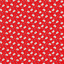 A swatch of bright red fabric featuring small calico kittens playing with yarn balls