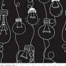 Fabric patterned with stylized white light bulb outlines on a black background with a ruler for scale