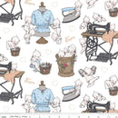 Fabric with vintage-style sewing scene featuring mannequins, sewing machine, and baby dolls on a white background.