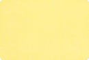 A solid pale yellow color swatch with a subtle textured finish and rounded corners.