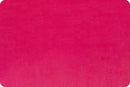 A bright fuchsia pink fabric swatch with rounded corners. 