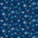Tossed menorahs, stars of David, and dreidels on a dark blue background.