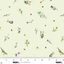 Fabric with cartoon characters and flowers on a light green background, ruler at the bottom for scale.