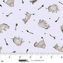 Fabric with cartoonish animal illustrations on a light blue background, featuring a ruler for scale.