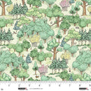 Pattern of trees and animals on fabric with a ruler for scale.