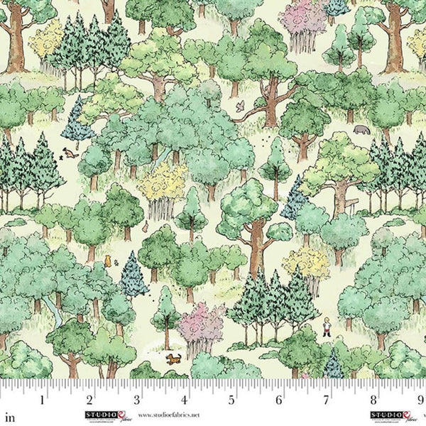 Pattern of trees and animals on fabric with a ruler for scale.