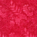 Batik fabric patterned with intricate pink tropical florals on a cherry pink background. 