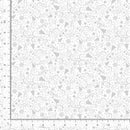 White on white fabric swatch with tossed swirls, christmas trees, snowflakes, stars, and ornaments with a ruler for scale