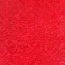 A Swatch of cotton Batik fabric featuring light red connected circles on a cherry red background. 