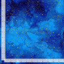 Fabric printed with a blue painterly night sky with metallic gold stars. There is a ruler at the left and bottom edge for scale. 