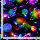 Colorful space-themed fabric with planets and stars, featuring a ruler for scale.