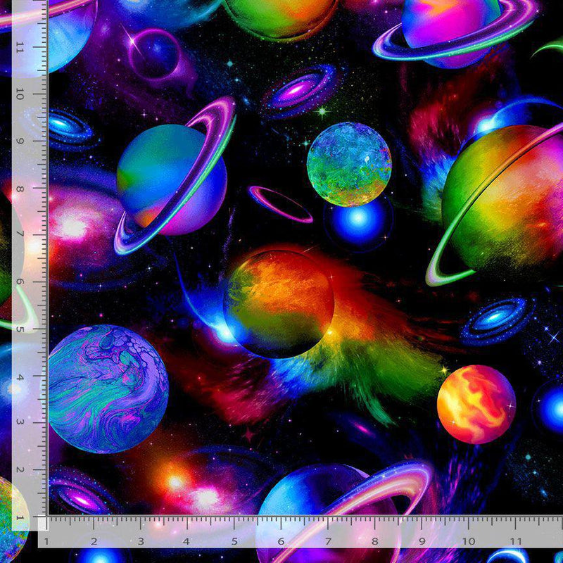 Colorful space-themed fabric with planets and stars, featuring a ruler for scale.