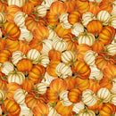 Fabric patterned with densely packed orange and white pumpkins on a black background. 