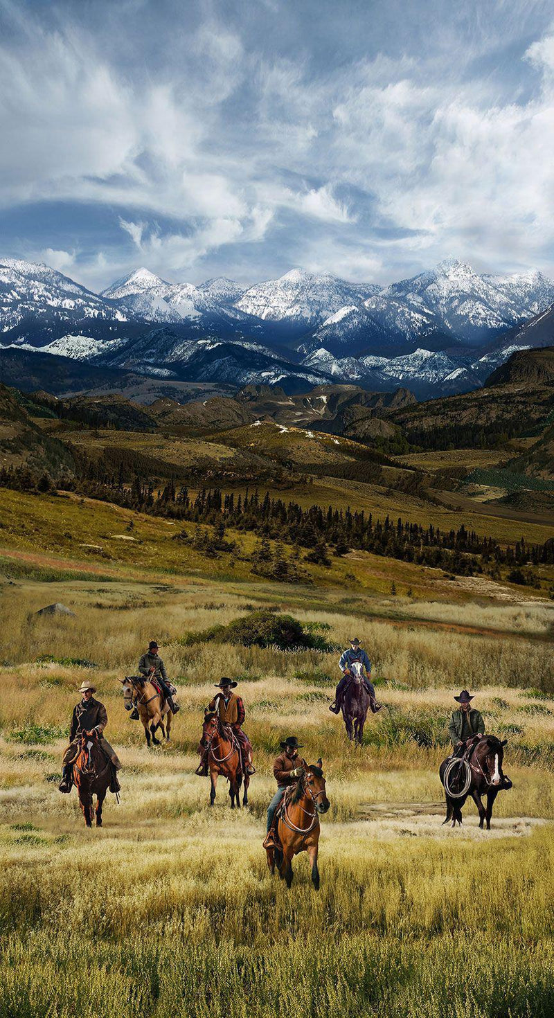 Fabric panel of Horses and riders in a field with mountains in the background