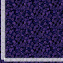 Fabric patterned with dark purple leaves with a ruler for scale